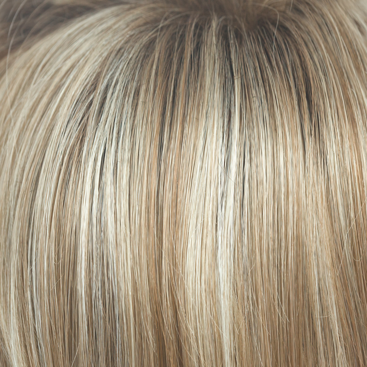 Sugar Cane-R - A darkish brown toffee rooted color flowing into a honey blond with burnt toffee, caramelized sugar lowlights and dusty blonde highlights.