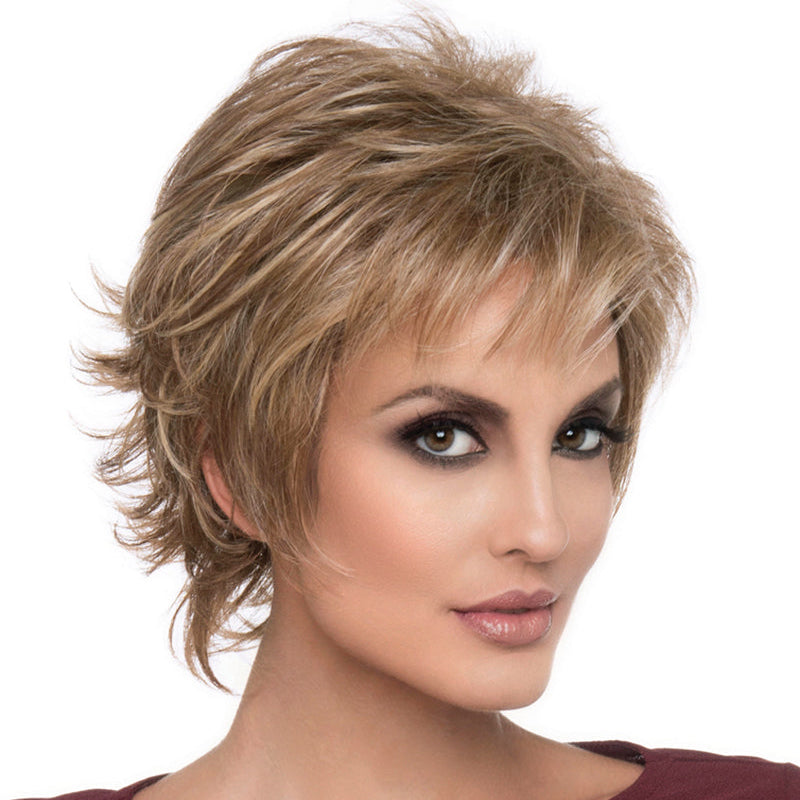 headshot of model wearing golden chin length wig
