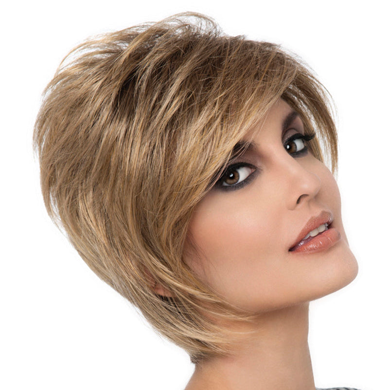 headshot of model wearing golden chin length wig