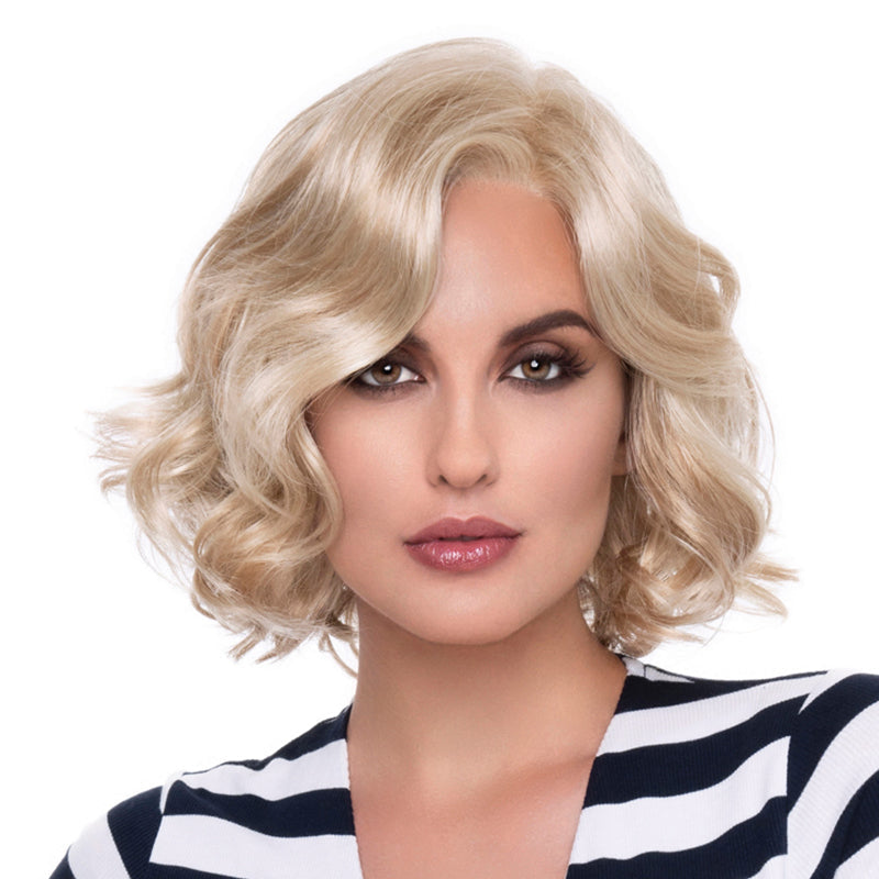 headshot of model wearing blonde chin length wig