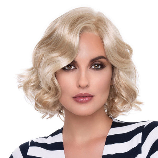 headshot of model wearing blonde chin length wig