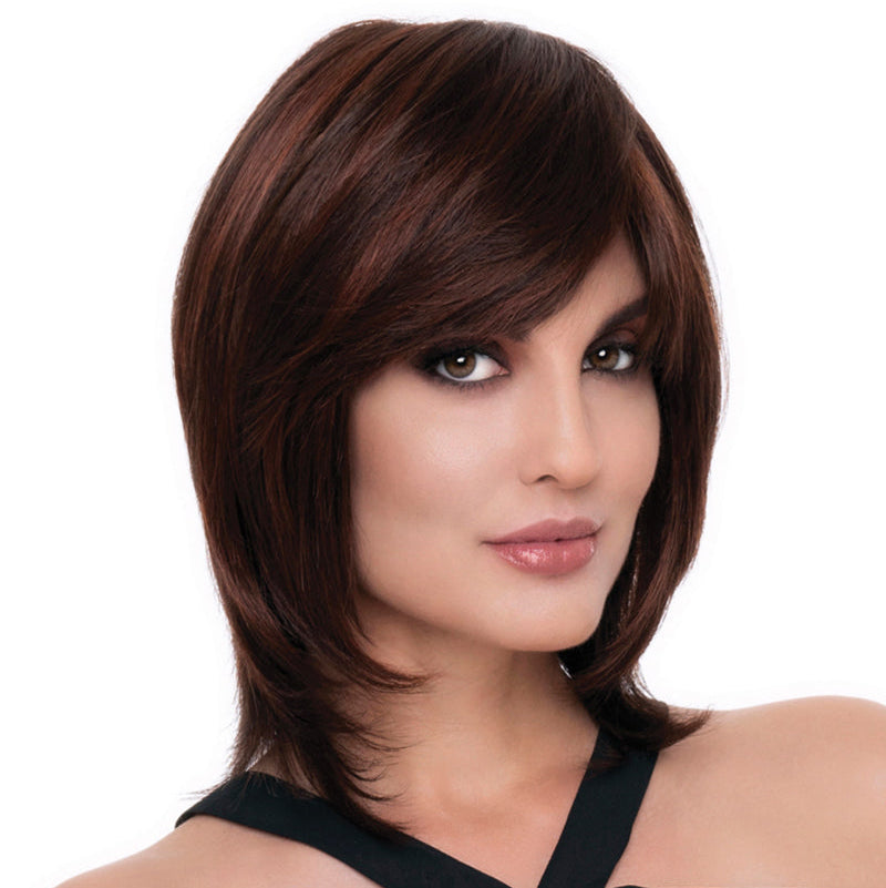 headshot of model wearing dark reddish brown chin length wig with layers