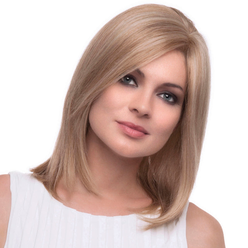 headshot of model wearing blonde shoulder length wig