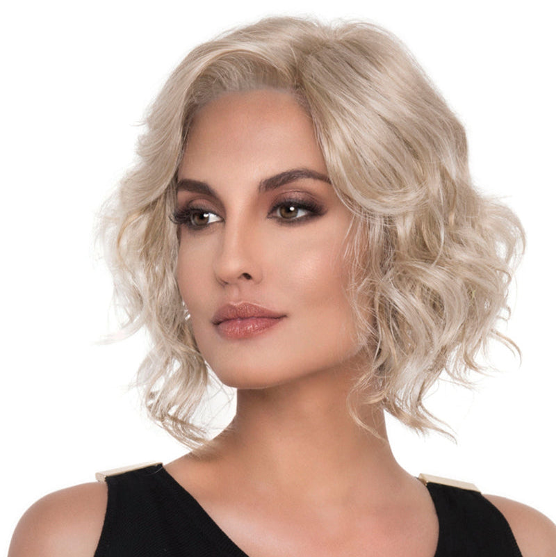 headshot of model wearing blonde chin length wig