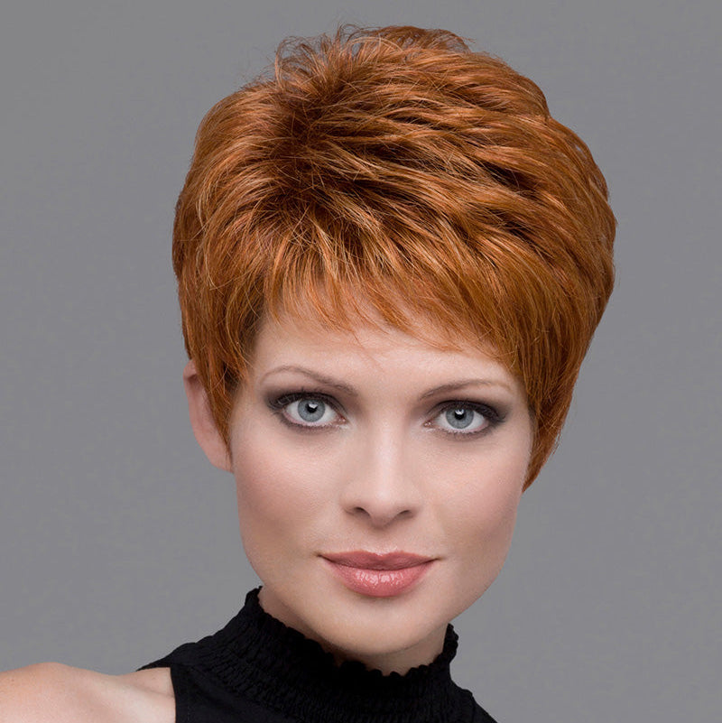 headshot of model wearing red pixie cut wig