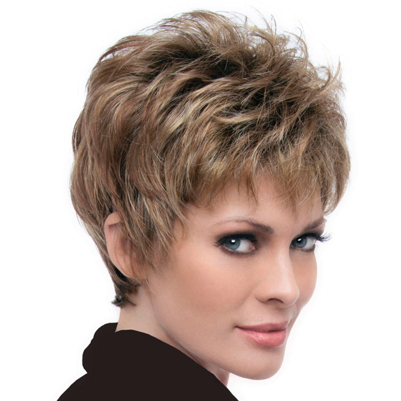 headshot of model wearing light brown pixie style wig