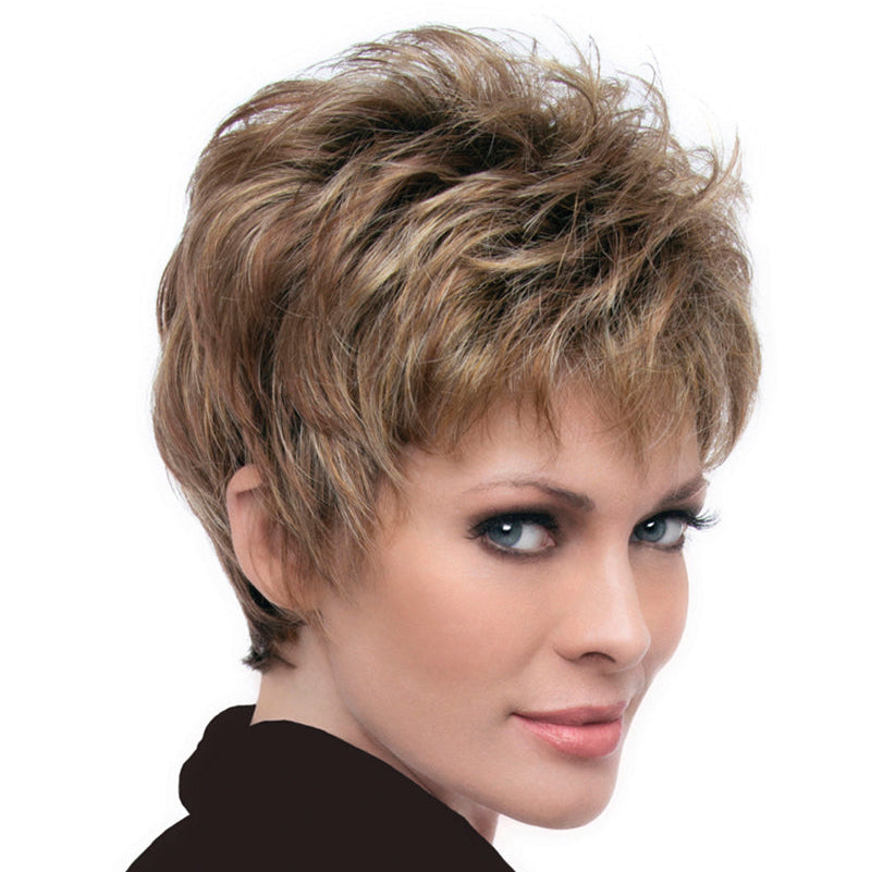 headshot of model wearing light brown pixie style wig
