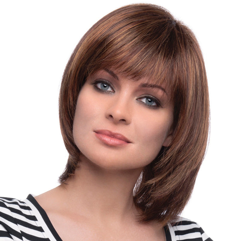 headshot of model wearing brown layered chin length wig