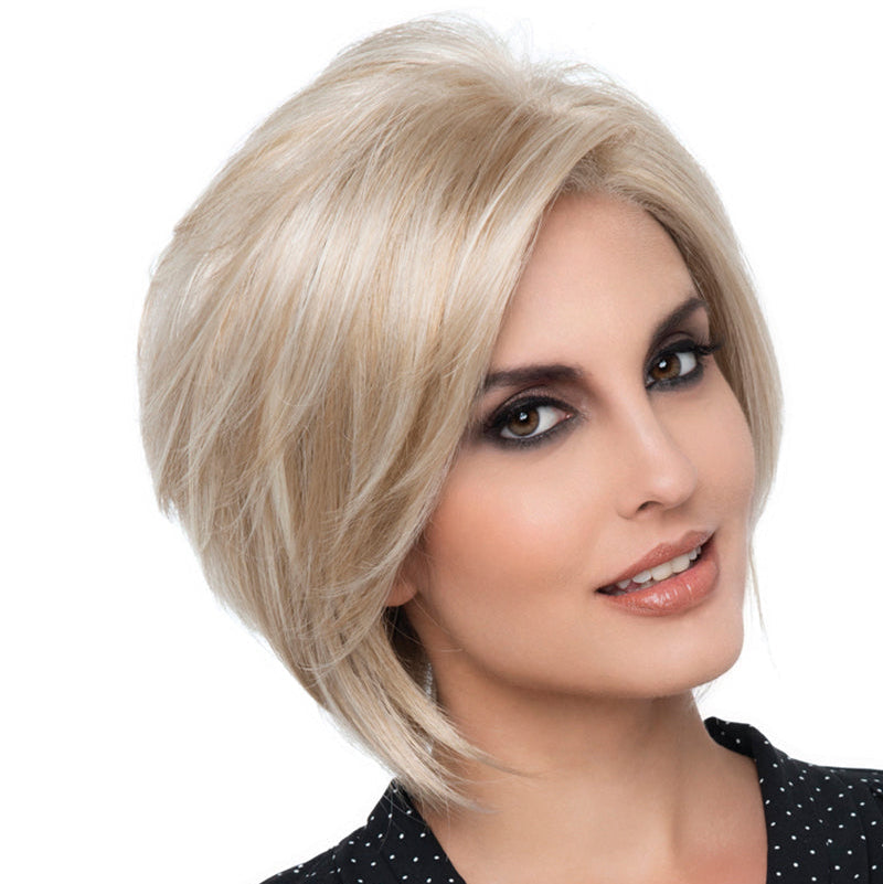 headshot of model wearing blonde bob style wig
