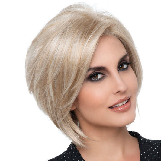 headshot of model wearing blonde bob style wig