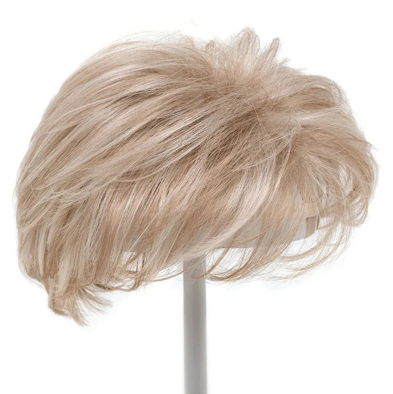 blonde layered topper on wig stand
