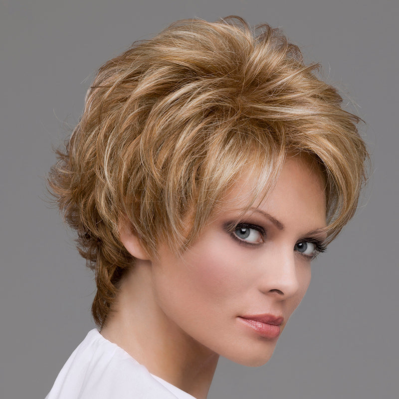 side profile of model wearing blonde pixie style wig