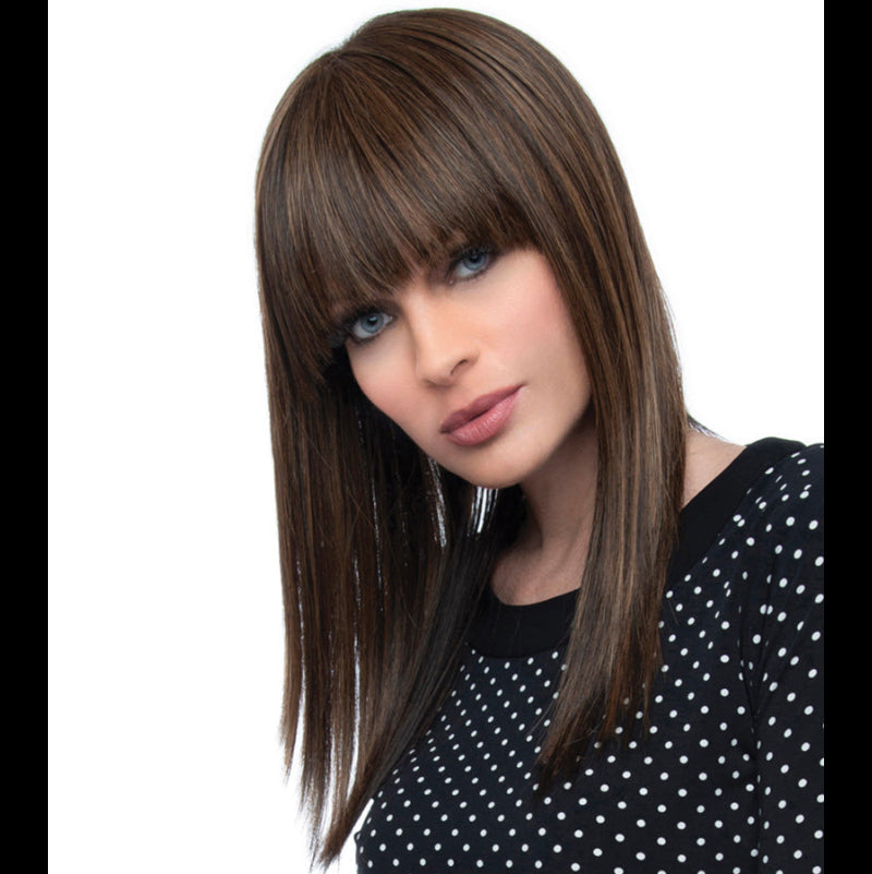 headshot of model wearing long brown wig with bangs
