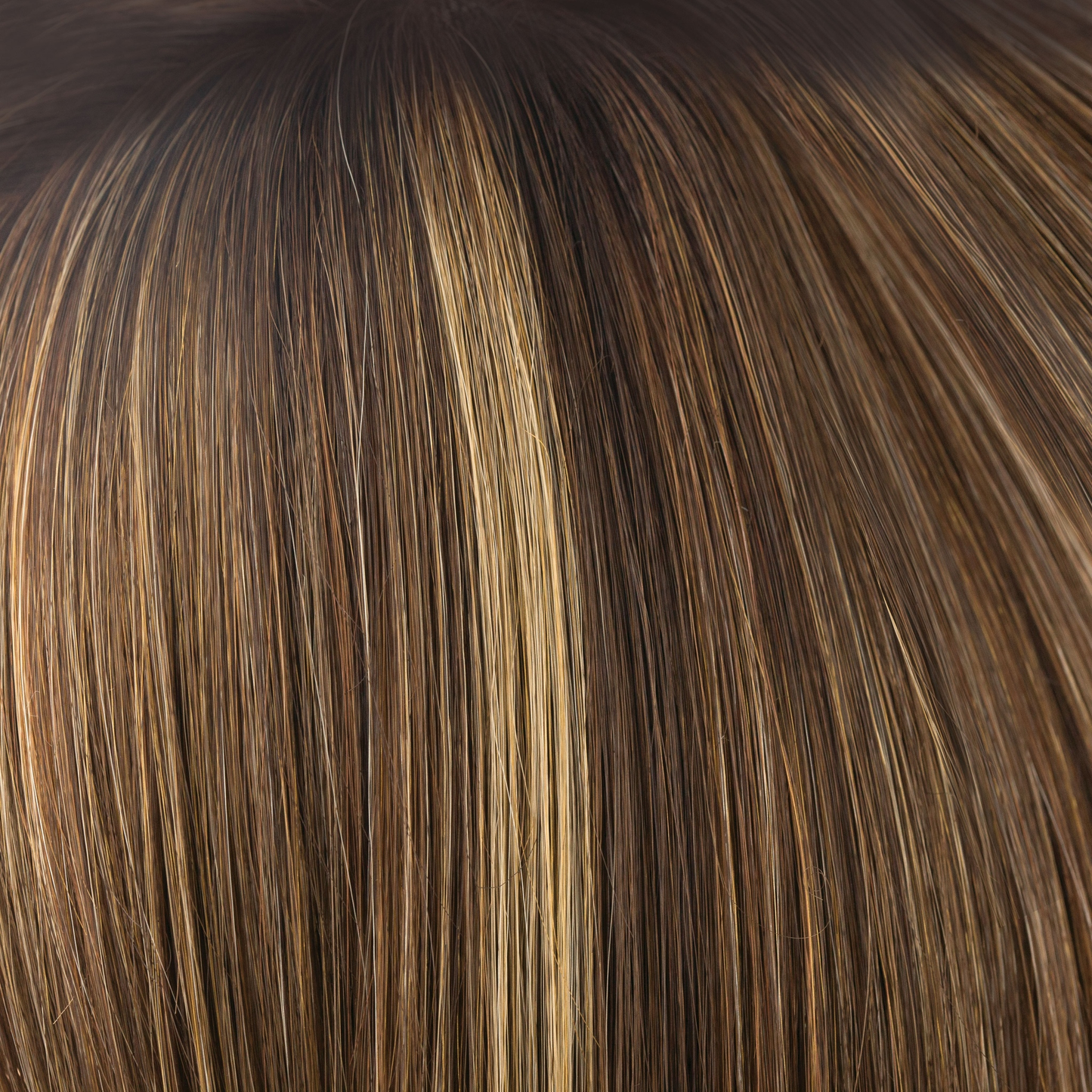 Almond Rocka-R  -  Cappucino-based, with a mix of dark strawberry blond and medium golden blond highlights with deep brown roots