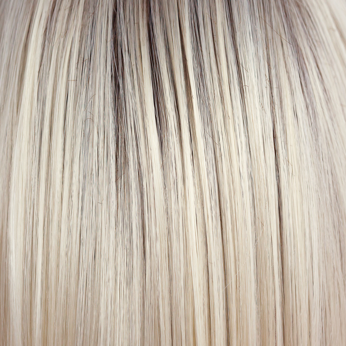 Coco Cream  -  A rich dark chocolate base that pushes the boundaries with its stunning displays of lily white chunky blond weaves and pale natural ash blond slices. Maximizing the impact of the style!