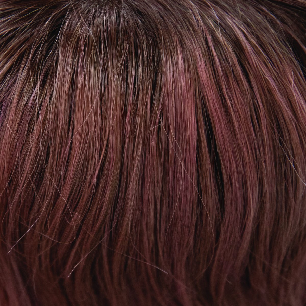 Dusty Rose  -  A smoky fused medium coral red base with warm dark brown roots. Fresh-tone beauty in bloom.