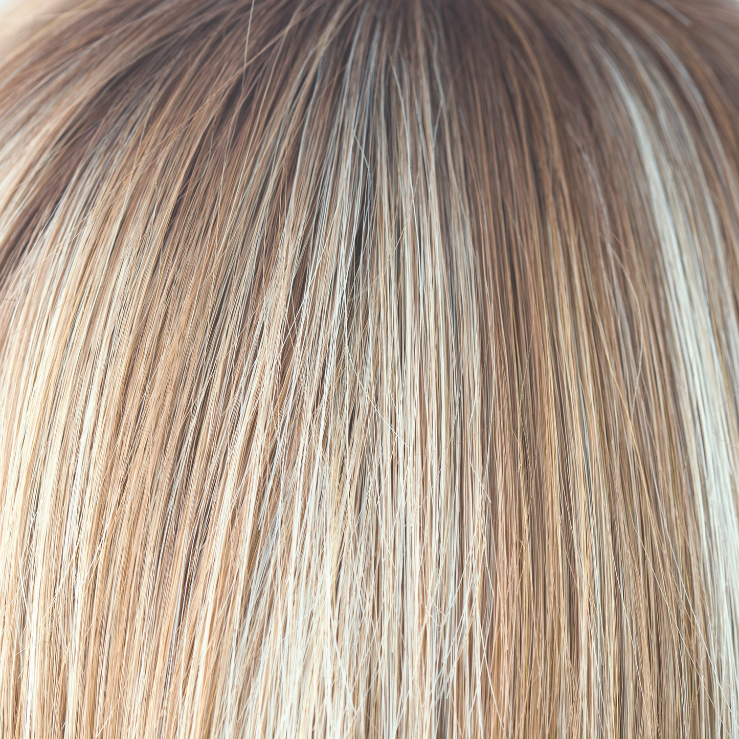 Nutmeg-R  -  This scrumptious rooted nutmeg blond with medium golden rooted base, blends into blond cream tones, warm coconut and honey slices. Nutmeg-R is classy and defined!